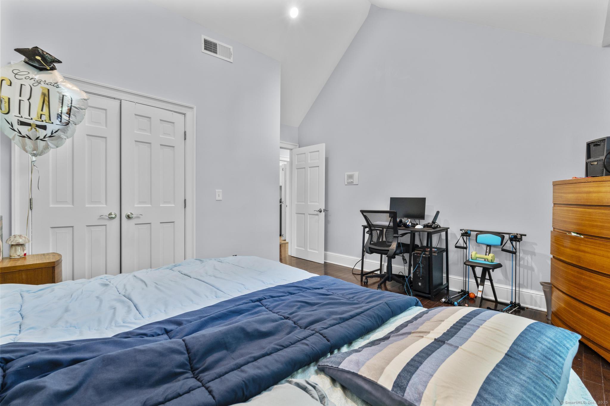 101 Brambly Hedge Circle Fairfield, CT 06824 - Photo 26 of 40 a bedroom with a bed and a table in it