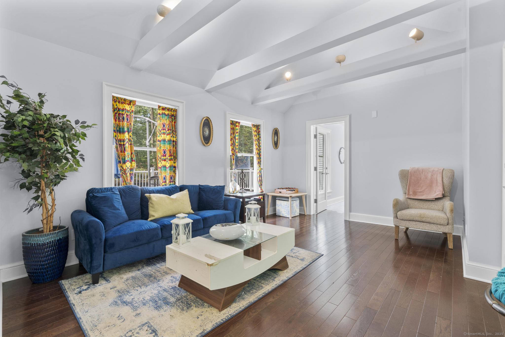 101 Brambly Hedge Circle Fairfield, CT 06824 - Photo 29 of 40 a living room with furniture and a large window