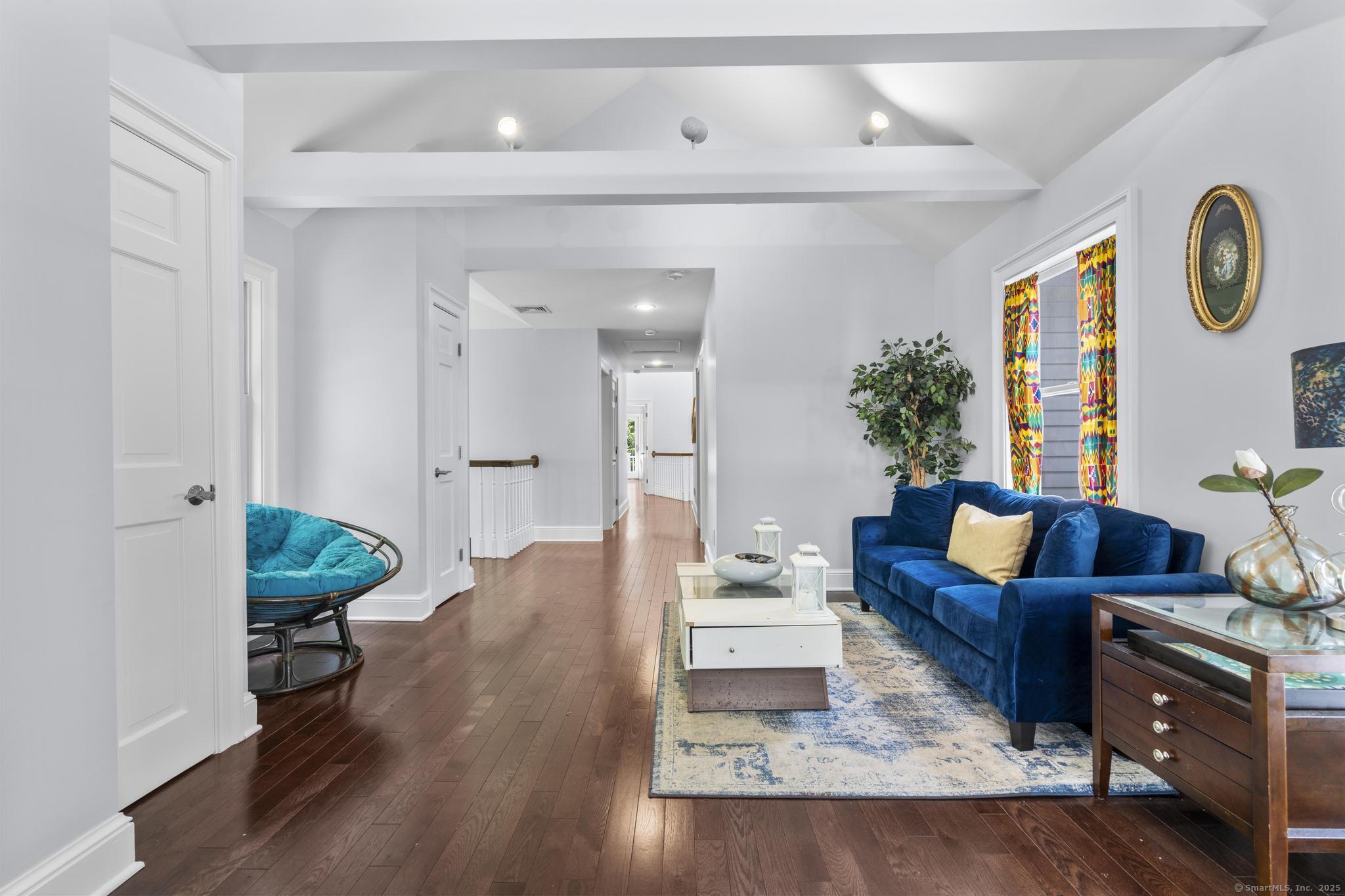 101 Brambly Hedge Circle Fairfield, CT 06824 - Photo 30 of 40 a living room with furniture and a wooden floor