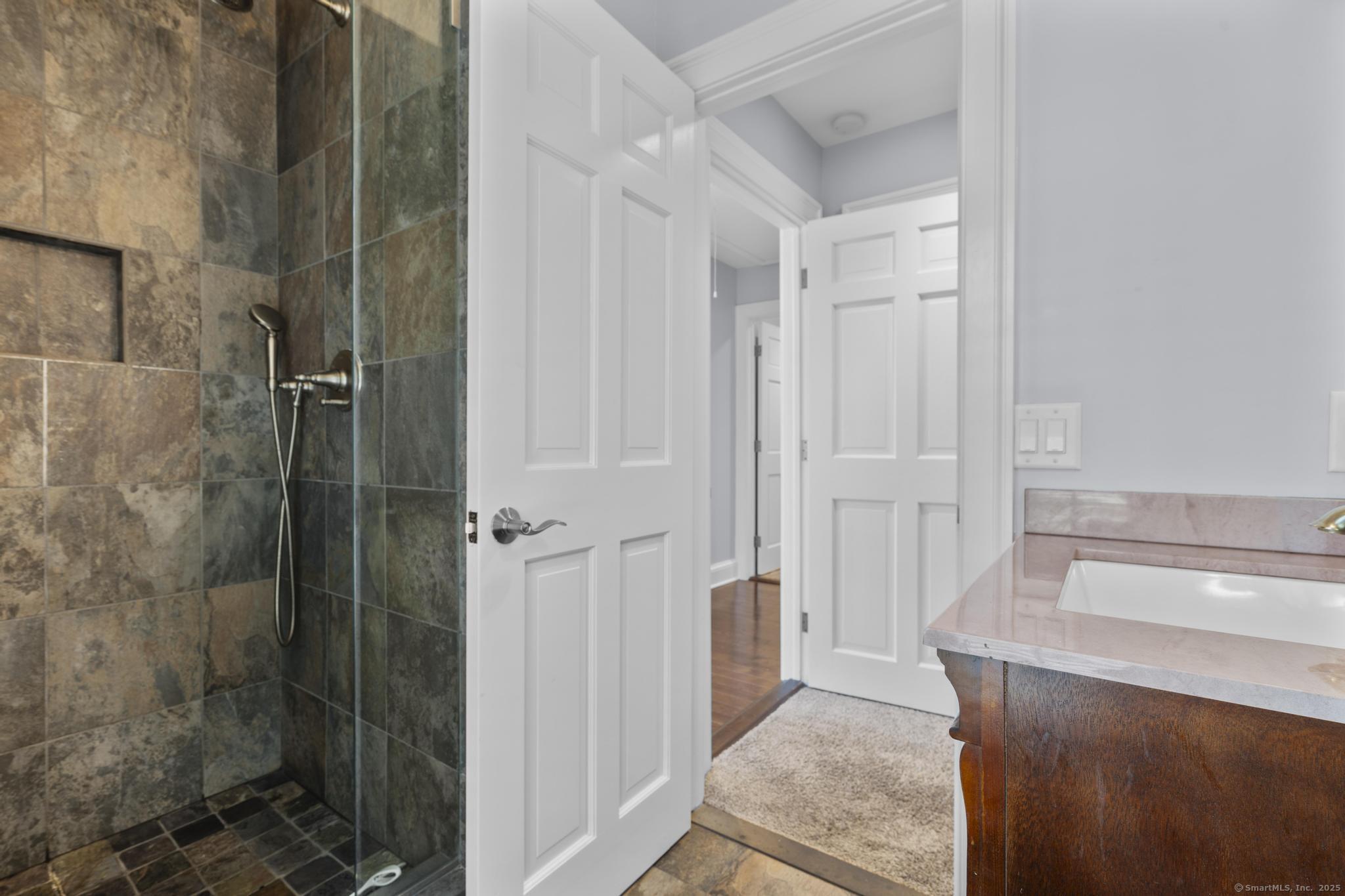 101 Brambly Hedge Circle Fairfield, CT 06824 - Photo 35 of 40 a bathroom with a sink and shower