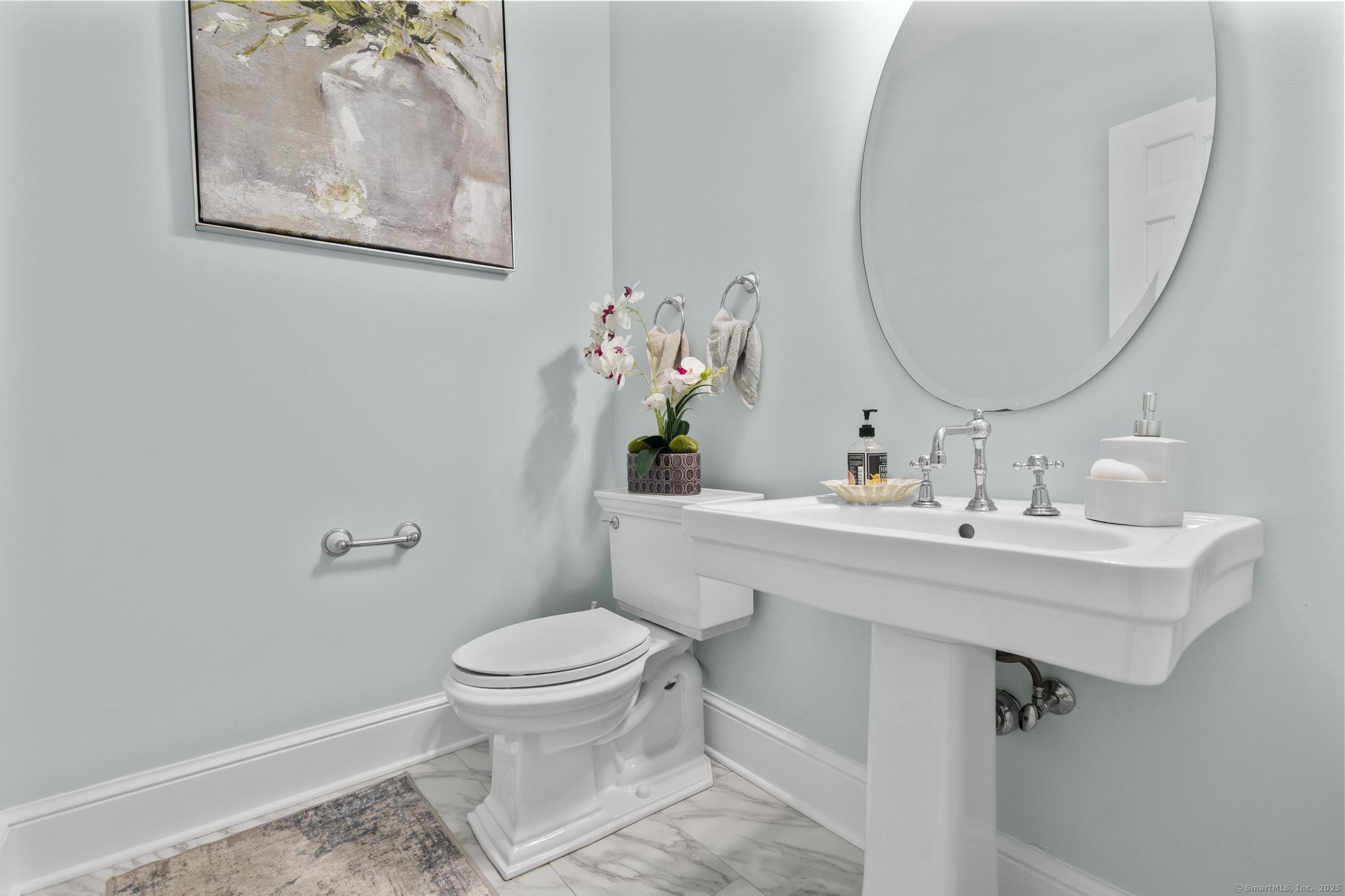 101 Brambly Hedge Circle Fairfield, CT 06824 - Photo 36 of 40 a bathroom with a sink mirror and toilet