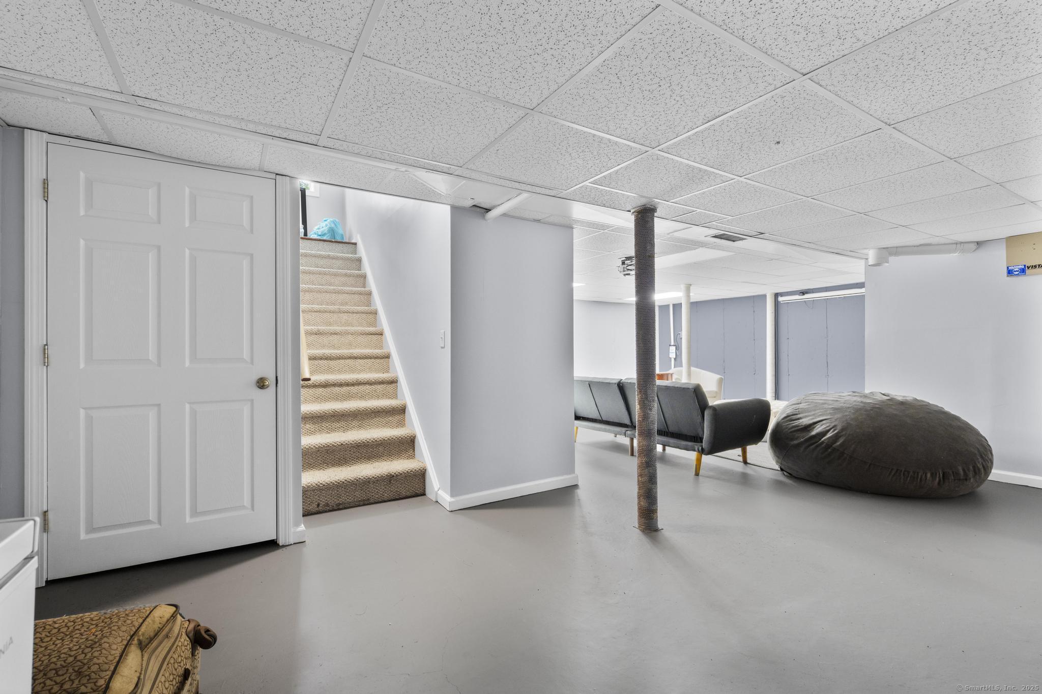 101 Brambly Hedge Circle Fairfield, CT 06824 - Photo 37 of 40 a bedroom with furniture and a window