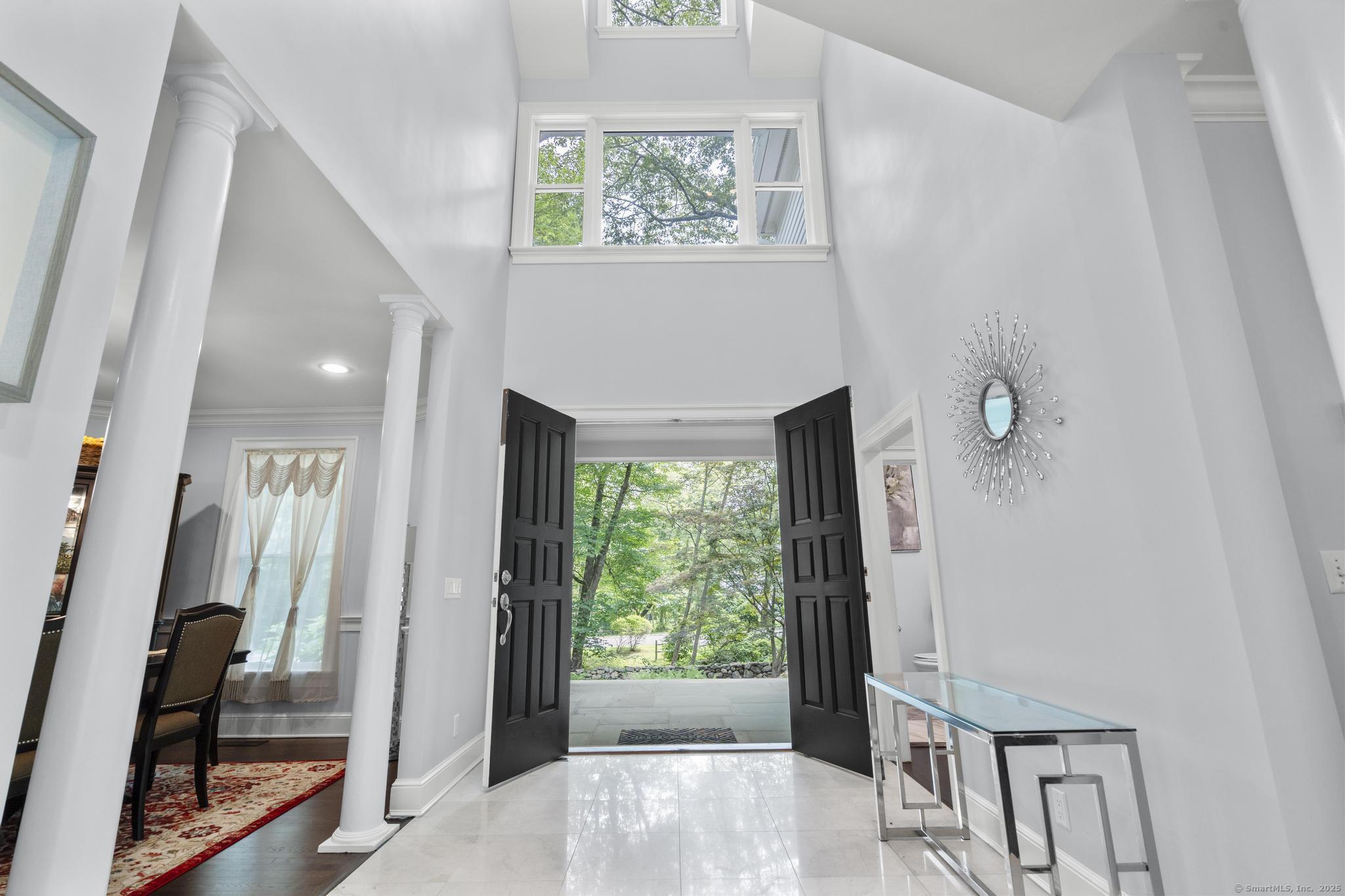 101 Brambly Hedge Circle Fairfield, CT 06824 - Photo 5 of 40 a view of an entryway with wooden floor
