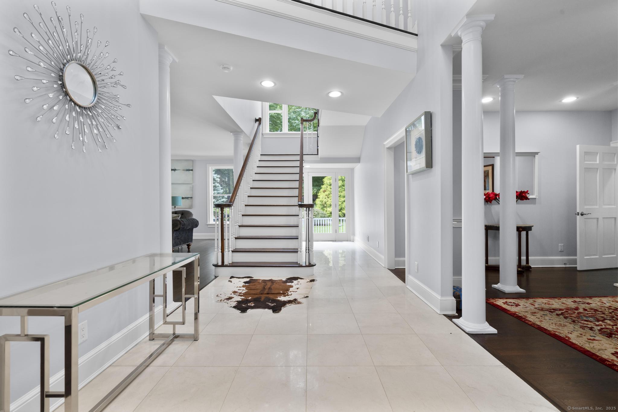 101 Brambly Hedge Circle Fairfield, CT 06824 - Photo 6 of 40 a view of an entryway with wooden floor