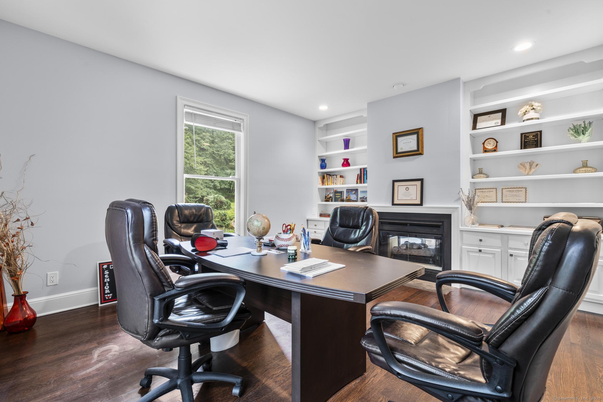101 Brambly Hedge Circle Fairfield, CT 06824 - Photo 7 of 40 a work room with furniture a rug and a window