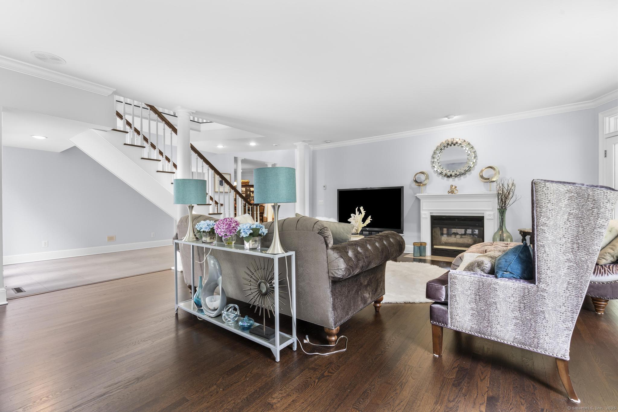 101 Brambly Hedge Circle Fairfield, CT 06824 - Photo 9 of 40 a bed room with furniture and a fireplace