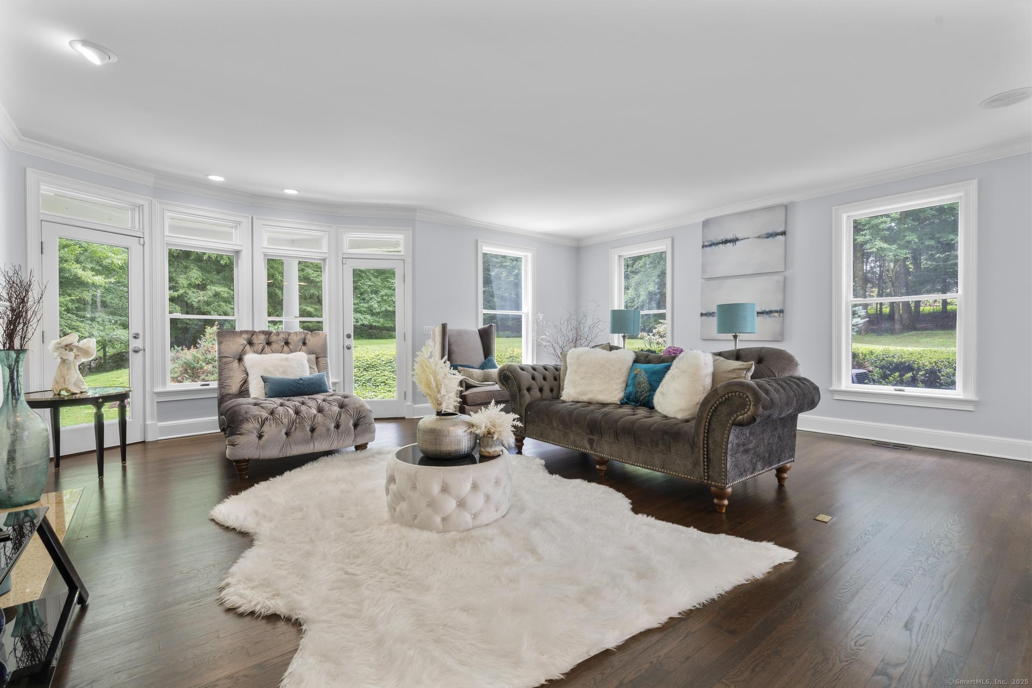 101 Brambly Hedge Circle Fairfield, CT 06824 - Photo 10 of 40 a living room with furniture and a large window