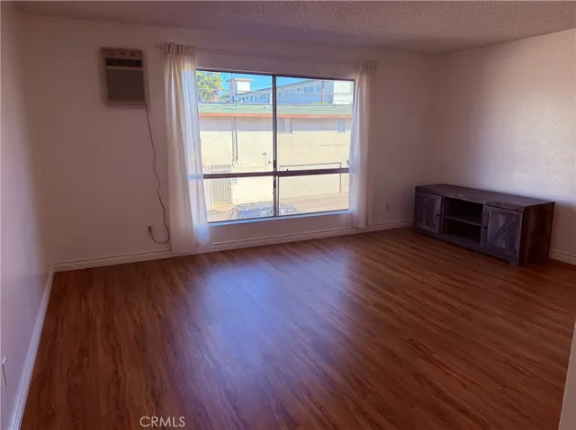 a kitchen with a refrigerator and cabinets