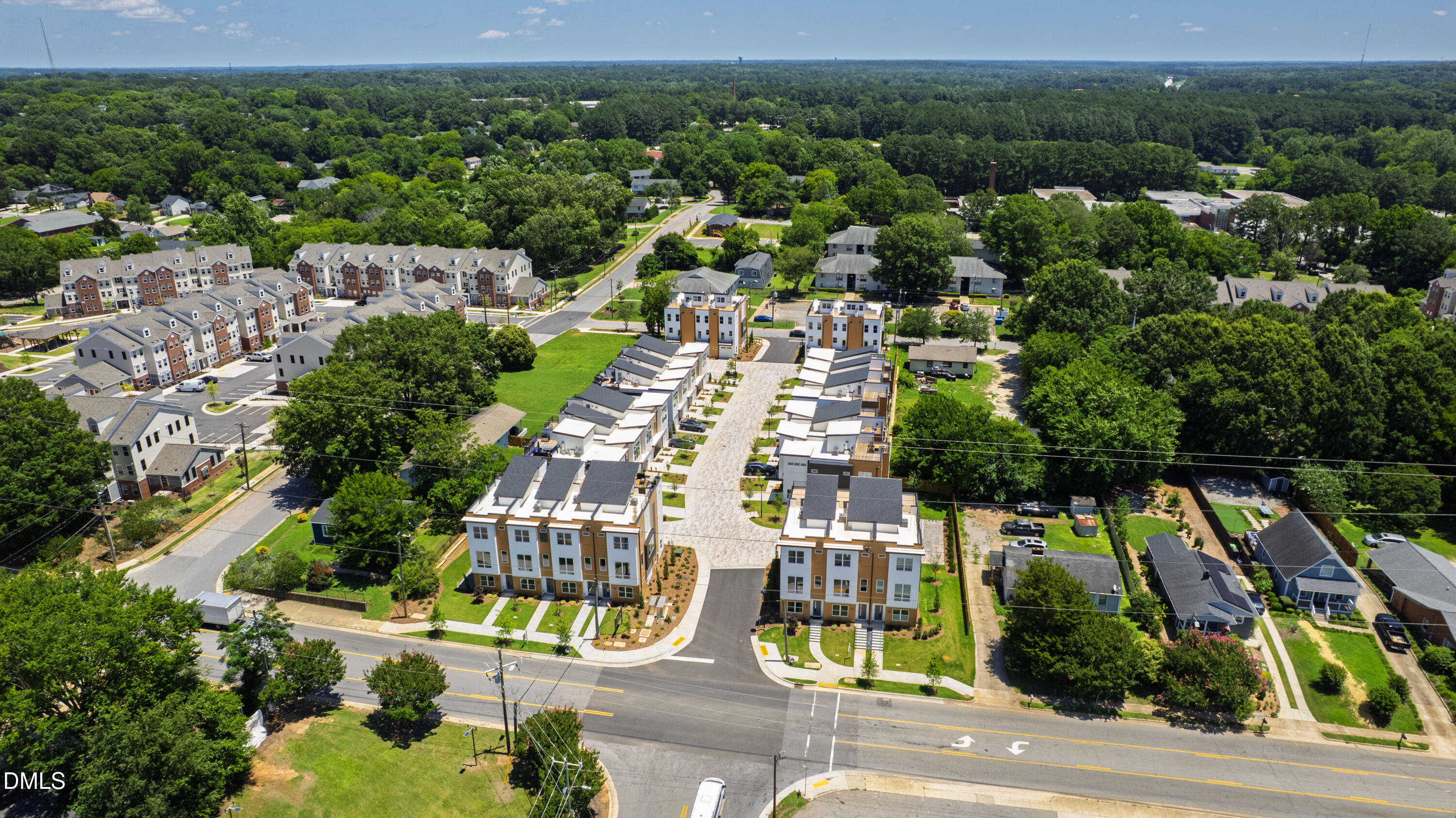 1313 Garner Road, Unit 102 Raleigh, NC 27610 - Photo 11 of 74 an aerial view of residential houses with outdoor space and street view