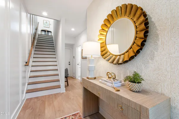 a kitchen with a sink a counter top space stainless steel appliances a stove and a window