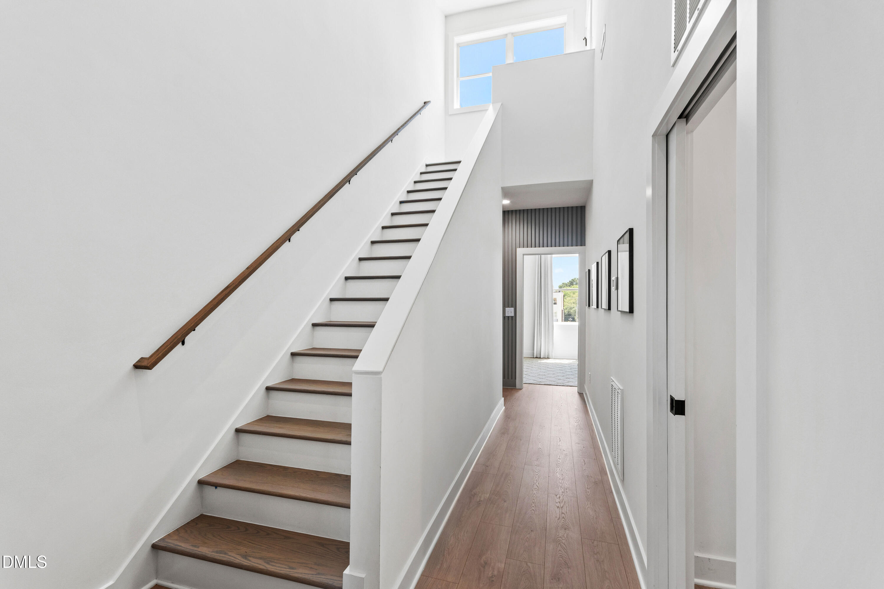 1313 Garner Road, Unit 102 Raleigh, NC 27610 - Photo 41 of 74 a view of entryway and hall with wooden floor