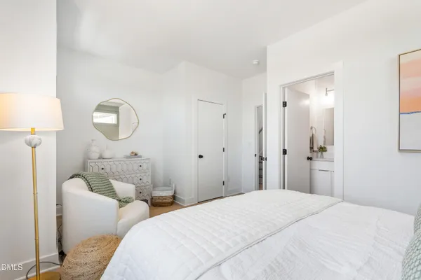 a room with furniture and potted plant