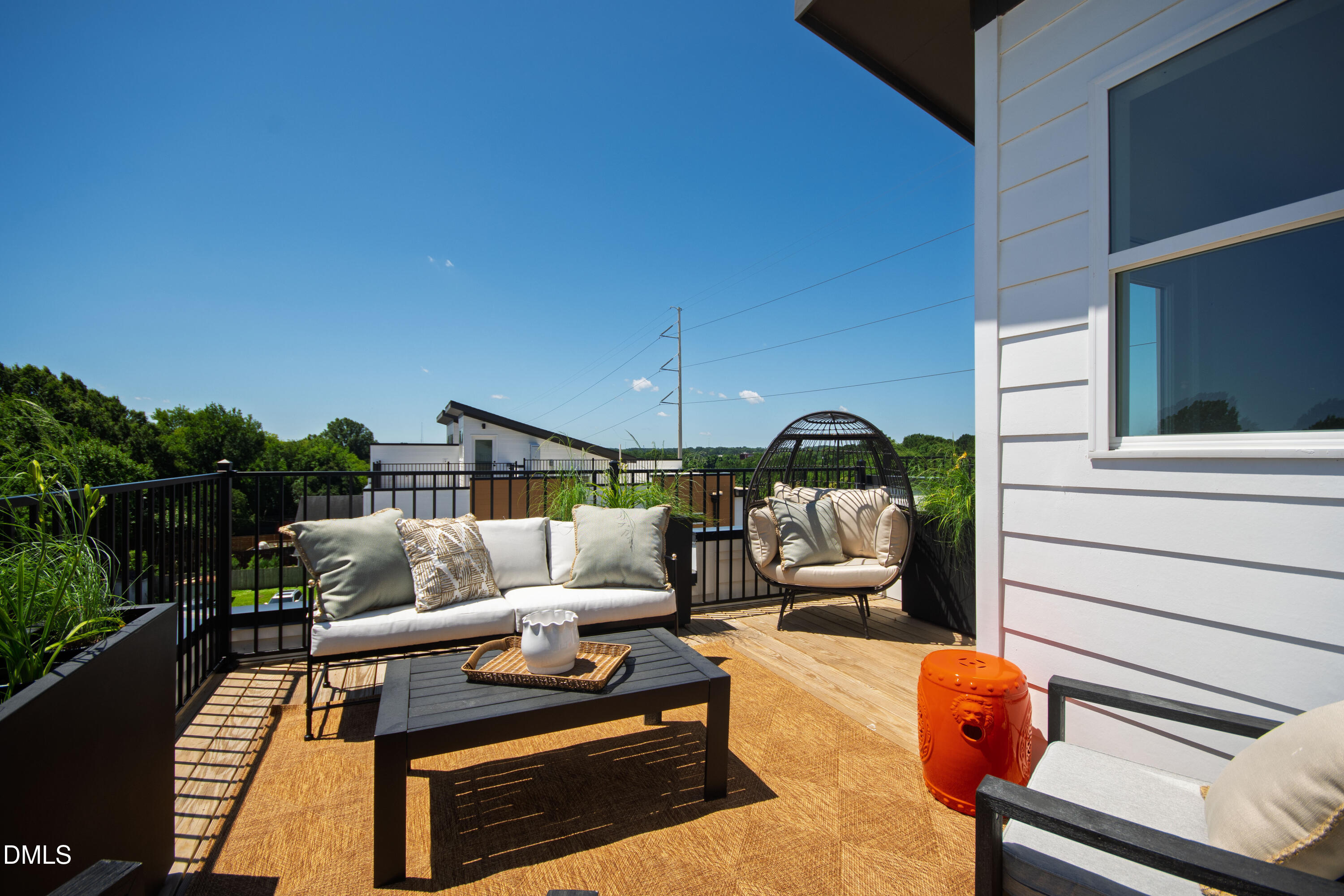 1313 Garner Road, Unit 102 Raleigh, NC 27610 - Photo 48 of 74 a patio with patio a couch and chairs