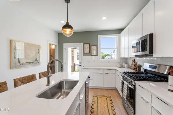 a bathroom with a double vanity sink and mirror