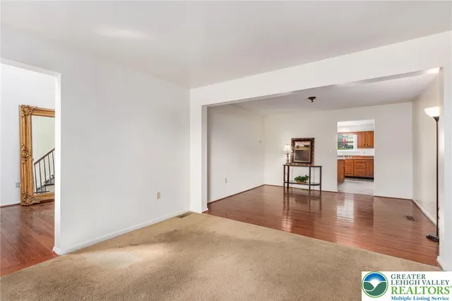 a view of empty room with lounge chair