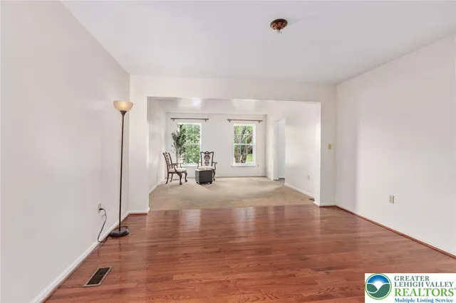 a view of livingroom with hardwood floor and a ceiling fan