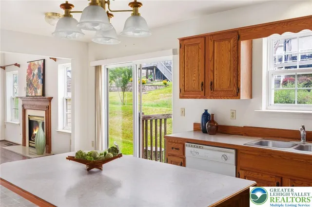 a kitchen with stainless steel appliances a sink a stove and a refrigerator
