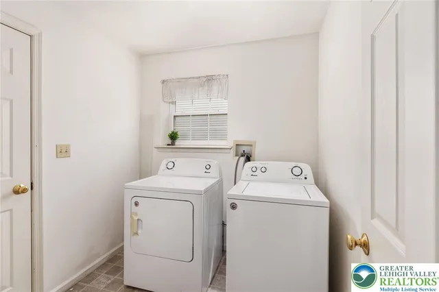 a utility room with dryer and washer