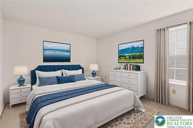 a bedroom with a bed and a tv on the dresser