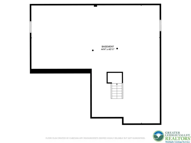 a picture of a bathroom with a white wall