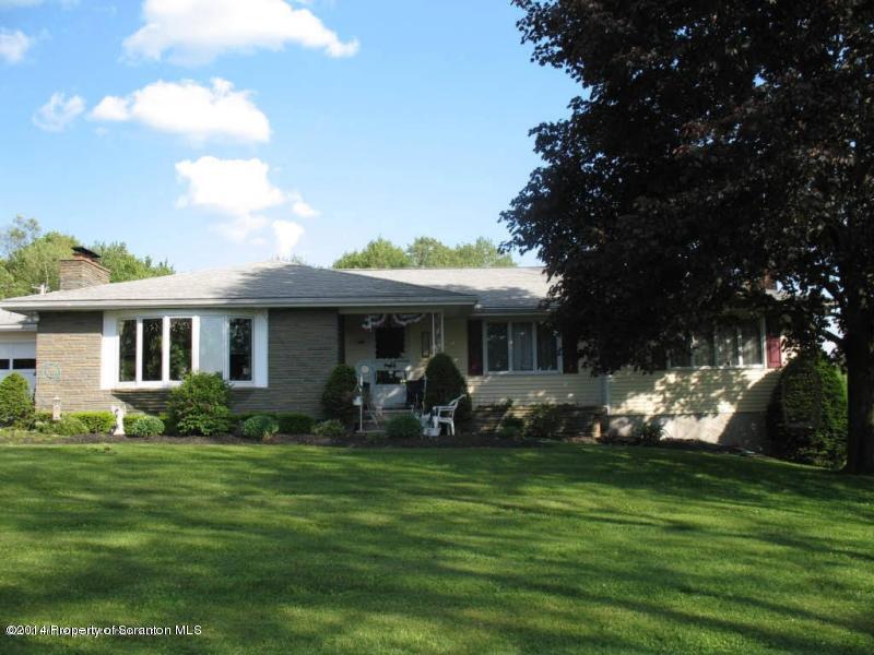 102 Griffin Road Moscow, PA 18444 - Photo 1 of 11 a front view of a house with garden