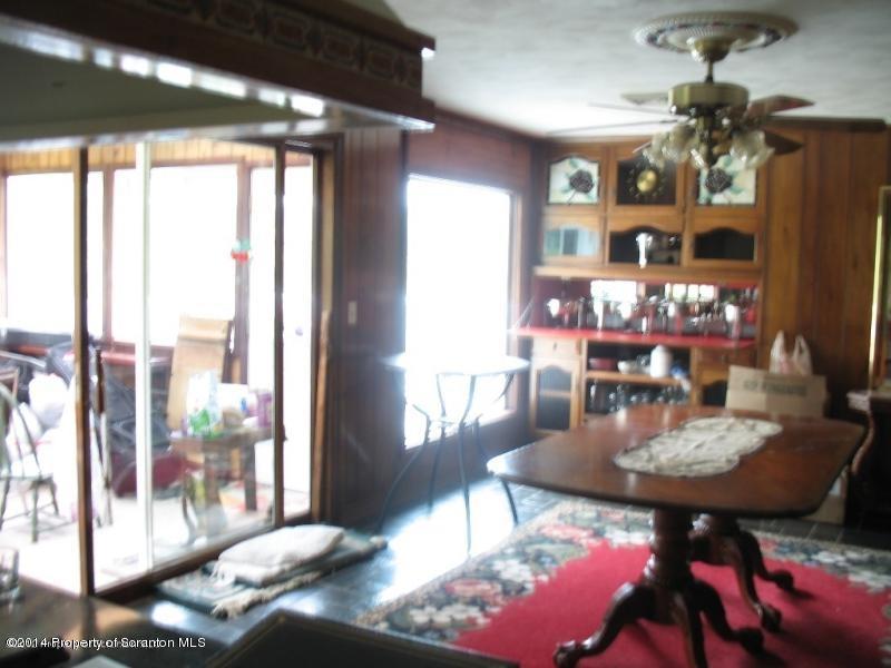 102 Griffin Road Moscow, PA 18444 - Photo 11 of 11 a view of a dining room with furniture and chandelier