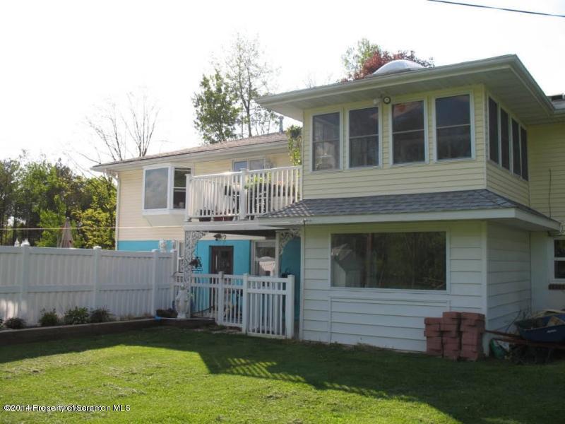 102 Griffin Road Moscow, PA 18444 - Photo 2 of 11 a front view of a house with a yard
