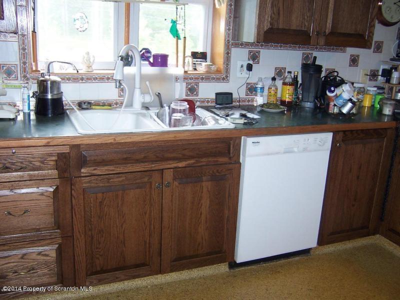 102 Griffin Road Moscow, PA 18444 - Photo 3 of 11 a kitchen with sink cabinets and counter space