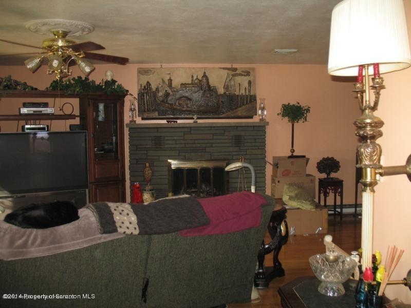 102 Griffin Road Moscow, PA 18444 - Photo 5 of 11 a living room with furniture and a fireplace