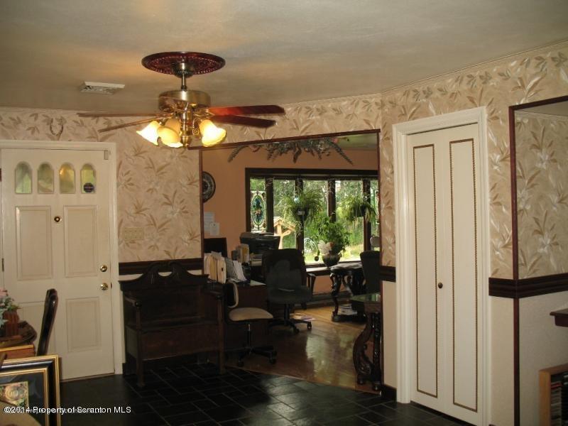 102 Griffin Road Moscow, PA 18444 - Photo 6 of 11 a living room with furniture and a chandelier