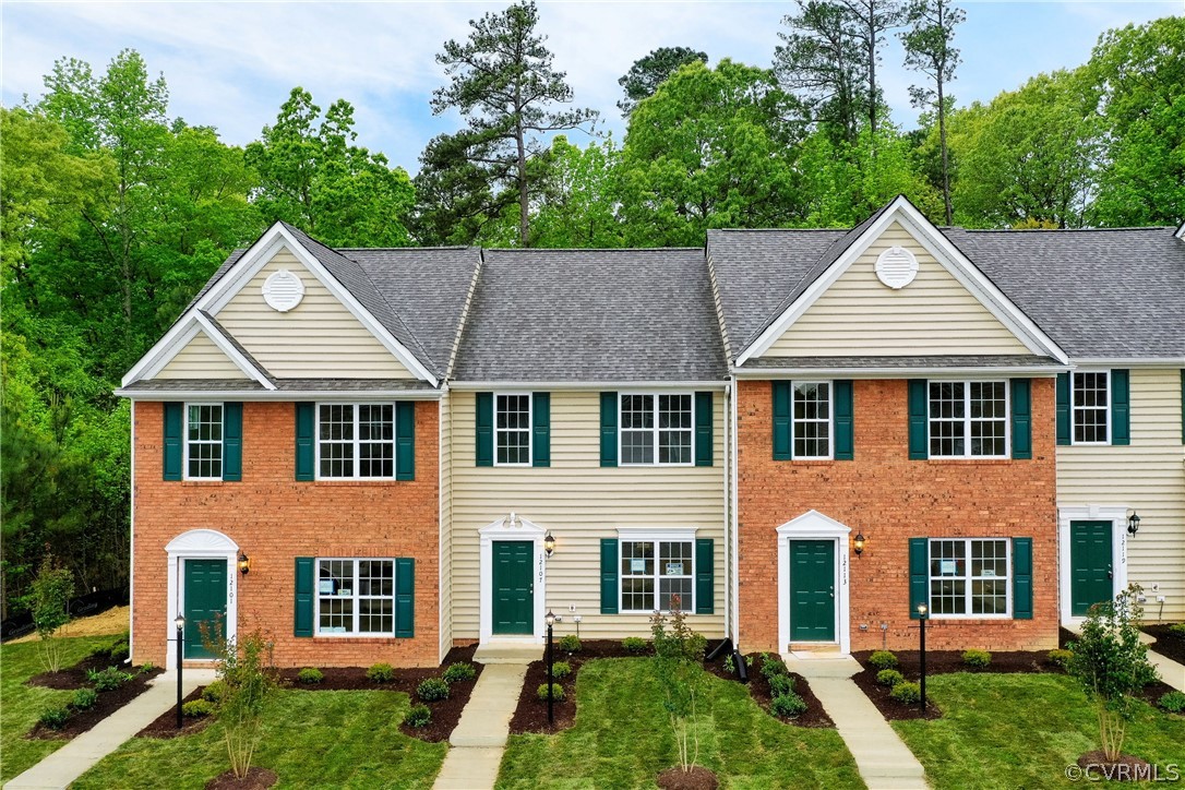 12107 Perdue Springs Loop Chester, VA 23831 - Photo 1 of 26 front view of a house with a yard