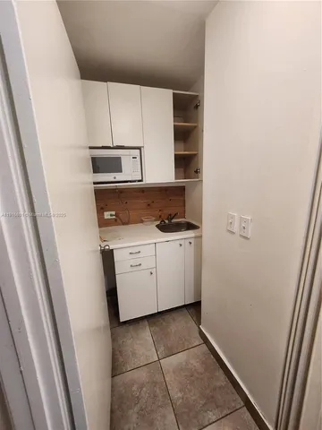 a utility room with cabinets