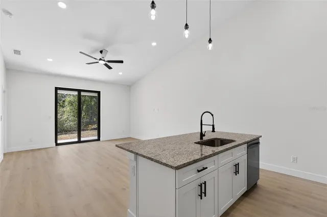 a kitchen with sink and window
