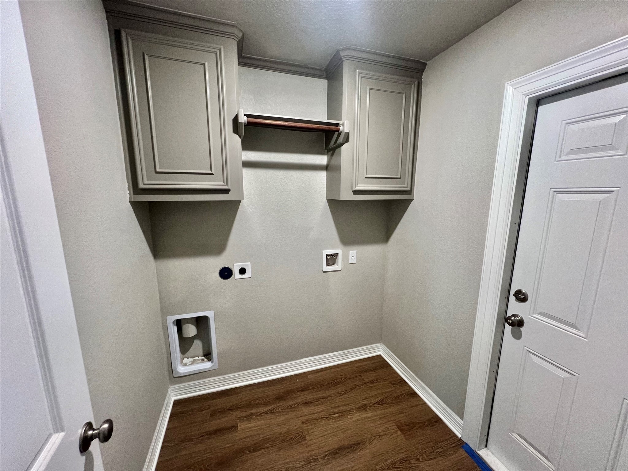 1031 South Anderson Street Angleton, TX 77515 - Photo 4 of 6 a view of storage and utility room with wooden floor