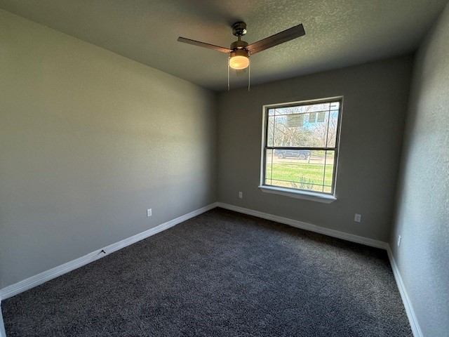 1031 South Anderson Street Angleton, TX 77515 - Photo 9 of 20 an empty room with a window and a fan