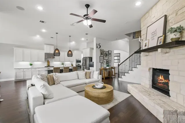 a living room with furniture fireplace and a flat screen tv