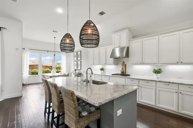 a very nice looking room with a large window and chandelier