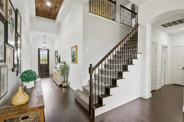 a view of a livingroom with a fireplace and workspace