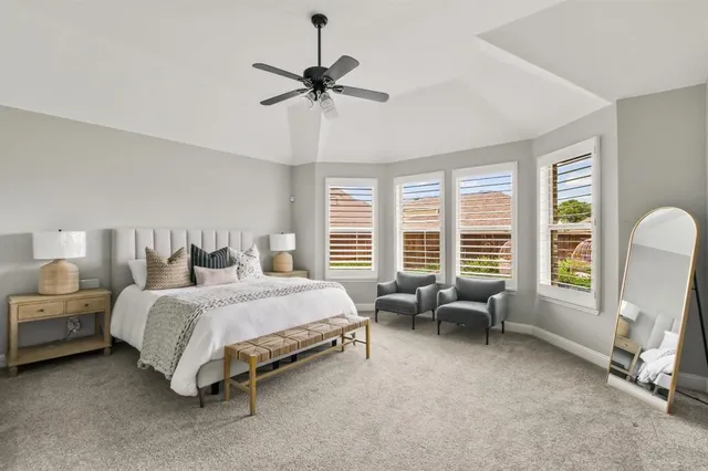 a bedroom with a bed and a couch