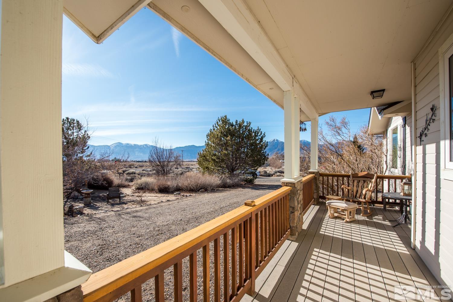 1480 Johnson Lane Minden, NV 89423 - Photo 4 of 31 a view of a balcony with wooden floor and fence
