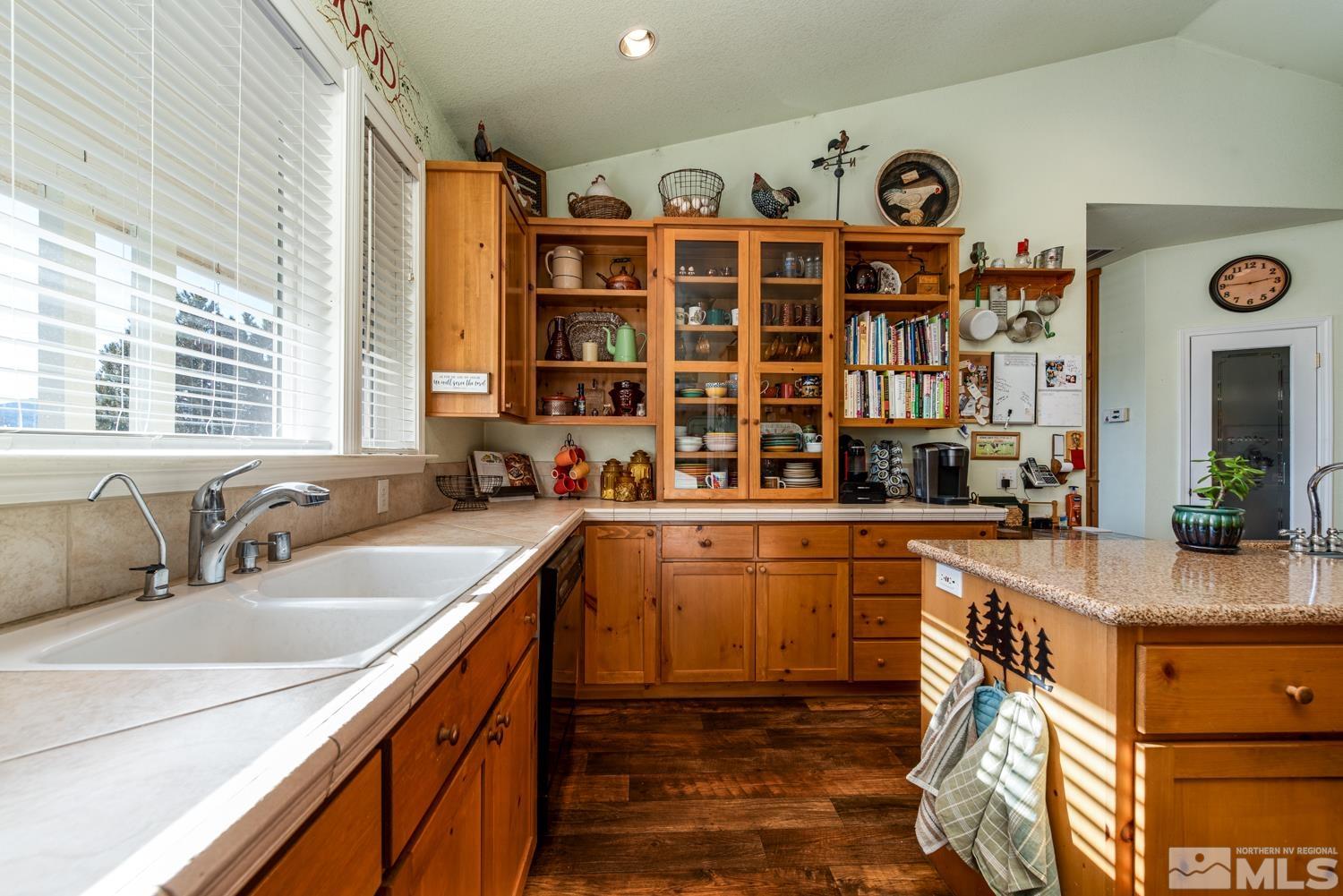 1480 Johnson Lane Minden, NV 89423 - Photo 7 of 31 a kitchen with stainless steel appliances a sink and cabinets