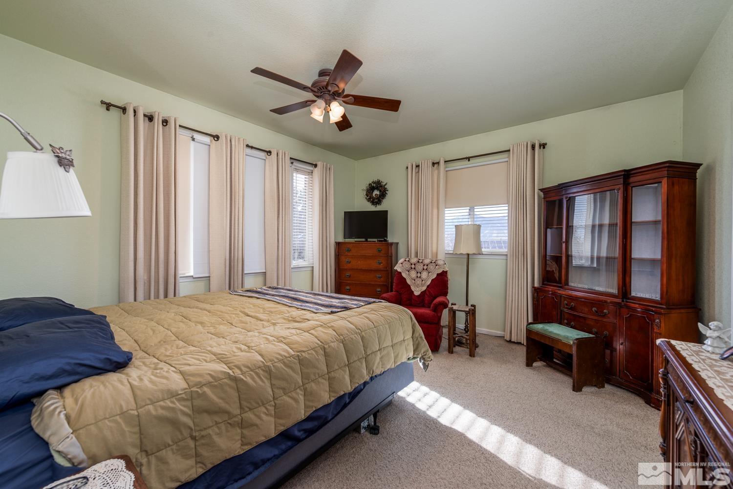 1480 Johnson Lane Minden, NV 89423 - Photo 9 of 31 a bedroom with a bed gym equipment and a window