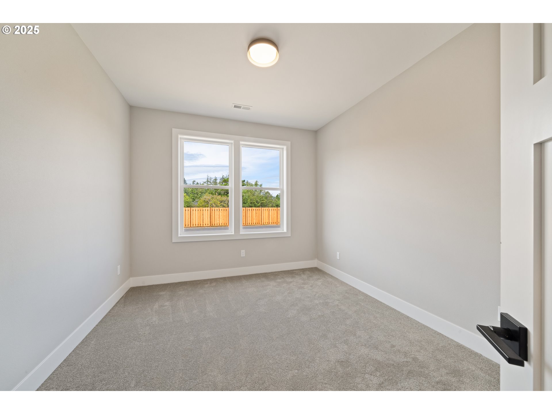 11645 Sawgrass Place Nehalem, OR 97131 - Photo 21 of 40 a view of an empty room with a window