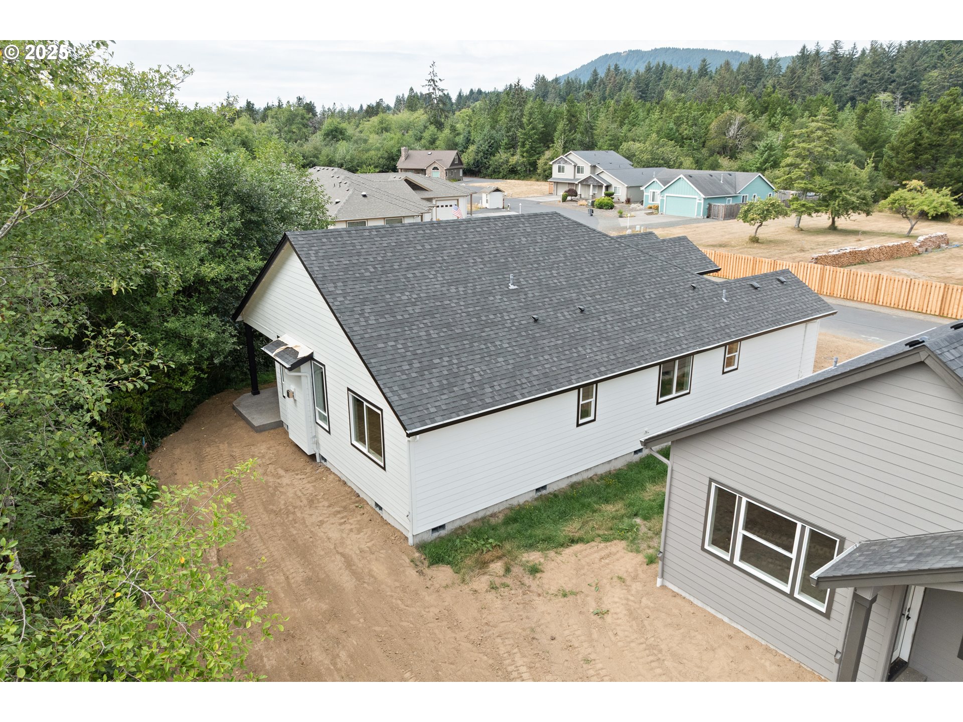 11645 Sawgrass Place Nehalem, OR 97131 - Photo 28 of 40 a aerial view of a house with a yard