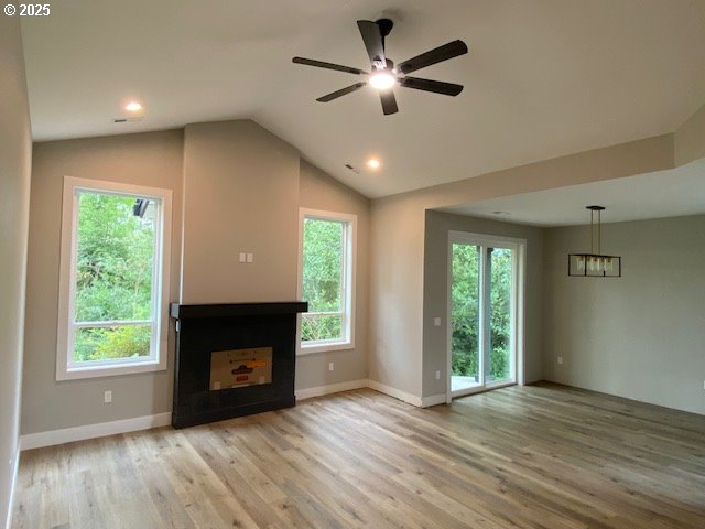 11645 Sawgrass Place Nehalem, OR 97131 - Photo 5 of 40 a view of an empty room with a fireplace and a window