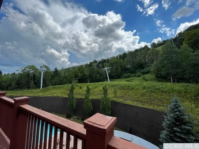 a view of a table and chairs in the garden