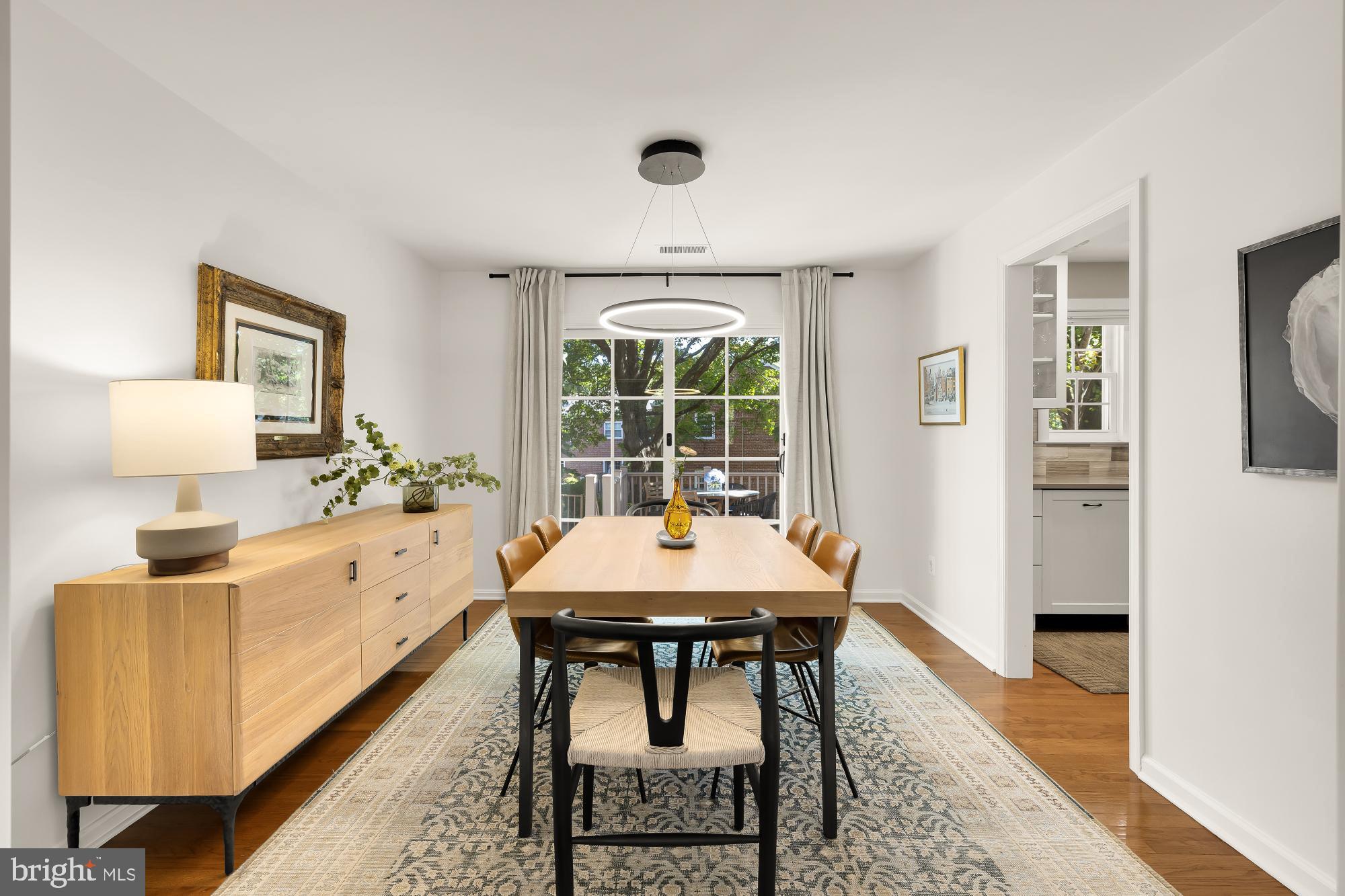 6723 Fairfax Road, Unit 15 Chevy Chase, MD 20815 - Photo 11 of 43 a view of a dining room with furniture window and wooden floor