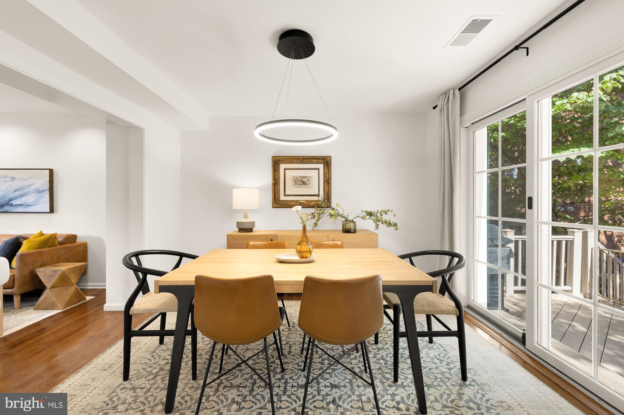 6723 Fairfax Road, Unit 15 Chevy Chase, MD 20815 - Photo 12 of 43 a view of a dining room with furniture window and outside view