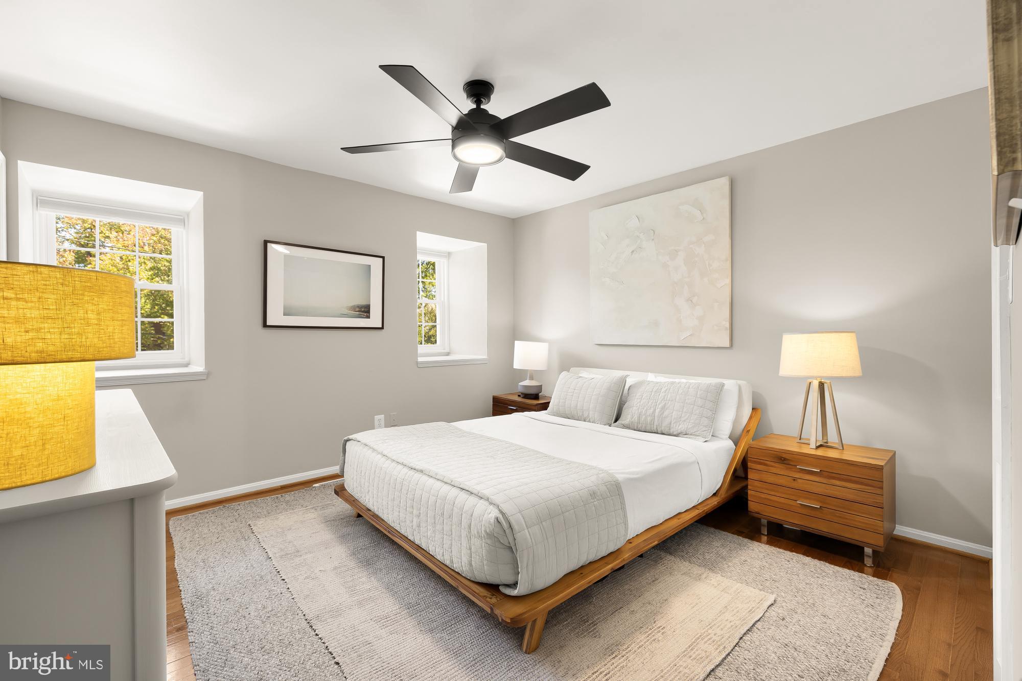 6723 Fairfax Road, Unit 15 Chevy Chase, MD 20815 - Photo 19 of 43 a bedroom with a bed and painting on the wall