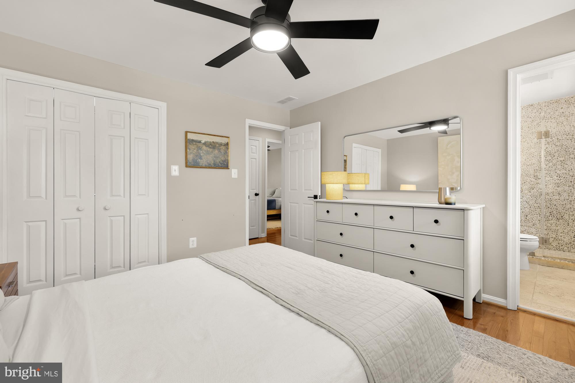 6723 Fairfax Road, Unit 15 Chevy Chase, MD 20815 - Photo 20 of 43 a bedroom with a bed and a mirror on the dresser